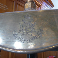 Battalion crest shown on the head of the bell tripod.